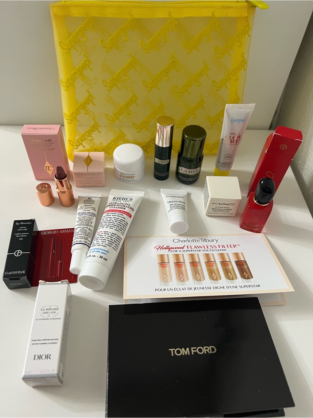 Supergoop! New Yellow Mesh Travel Pouch with mini skin care fsamples bundle. - Picture 3 of 8